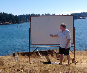Professor John Steffensen lecturing about fish swimming energetics outside in the sun, summer 2013. Credit: K.Ozolina.