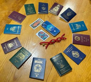 A ring of 13 colorful passports from 13 countries